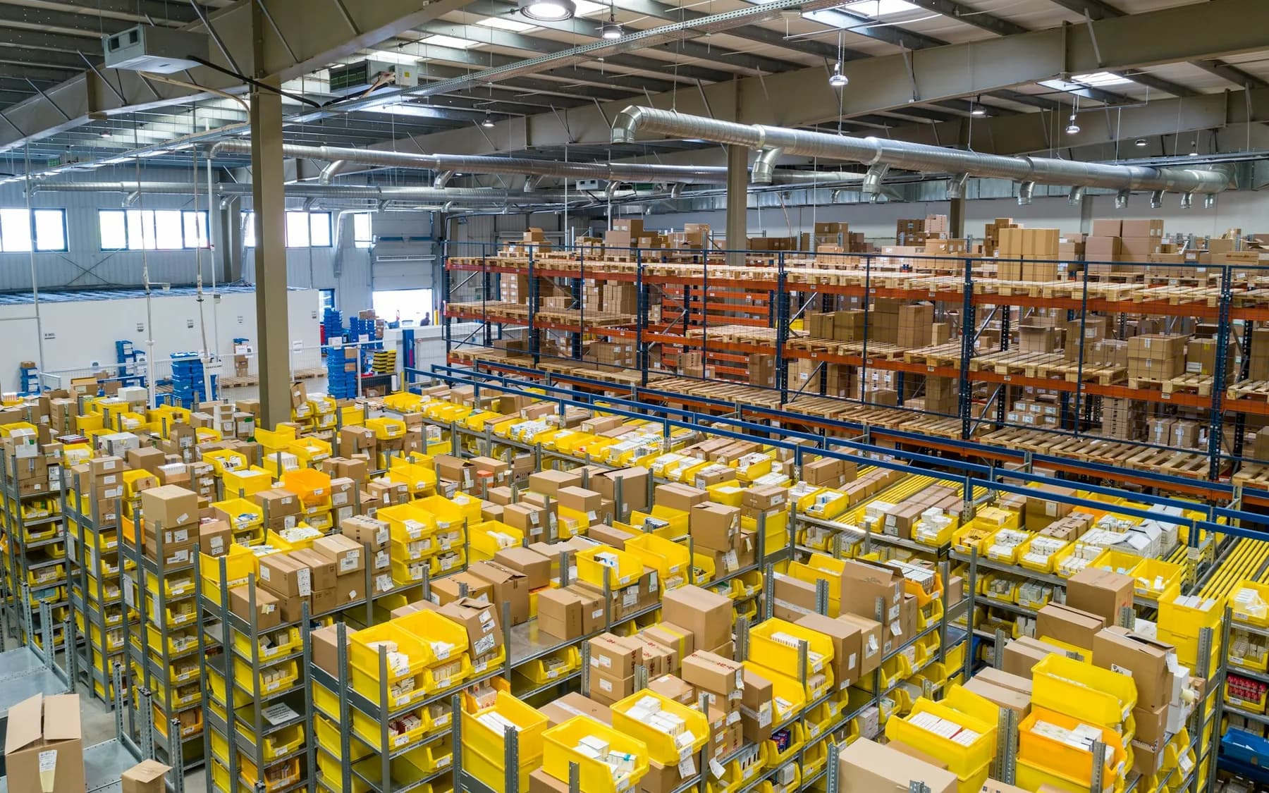 Warehouse logistics aisle with stacked inventory
